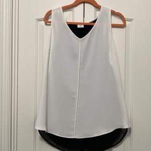 Cabi domino blouse size L NWOT. Split back with black mesh detailing.